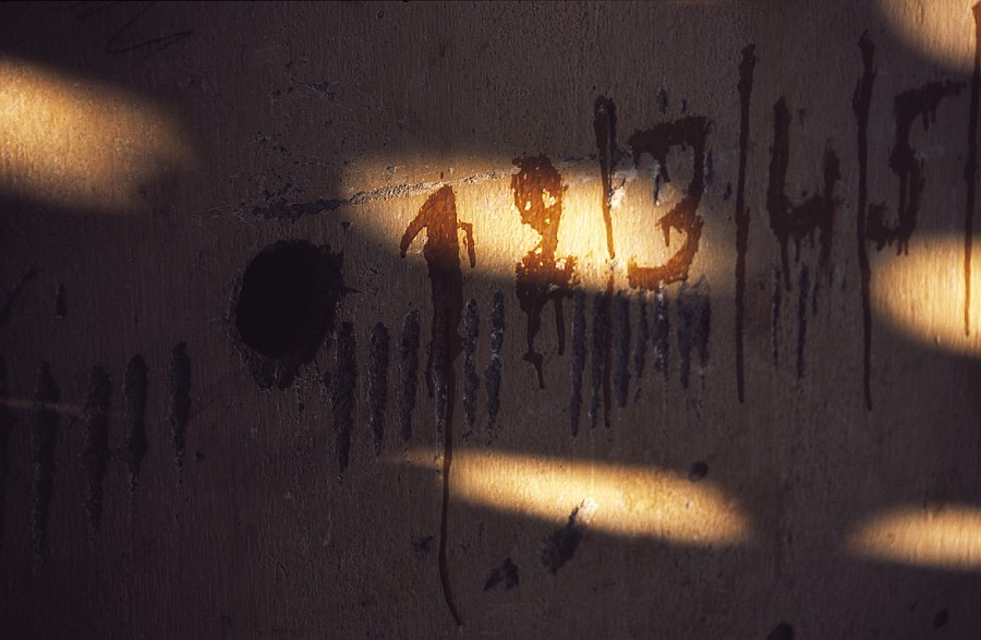 Tuol Sleng writing on the wall.jpg